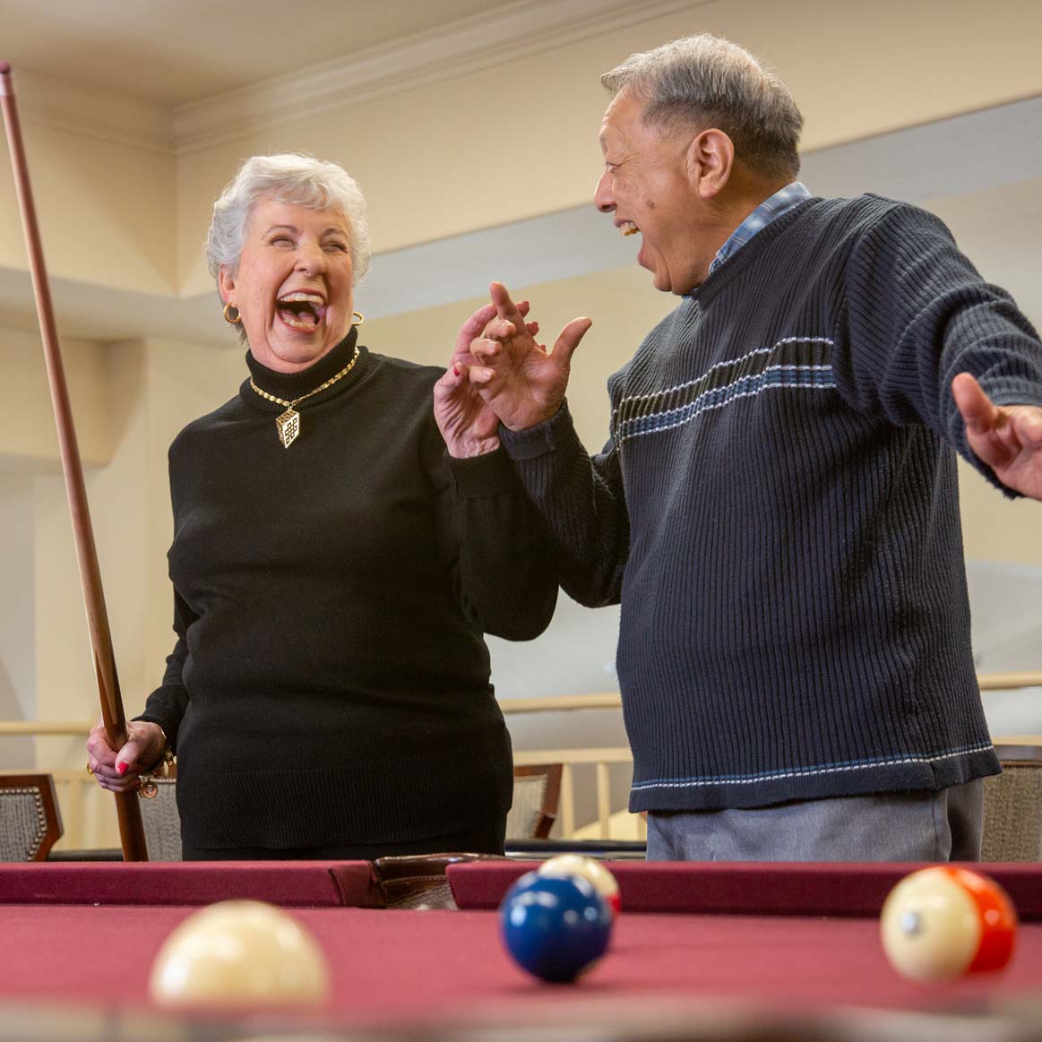 Residents playing billiards at StoneRidge